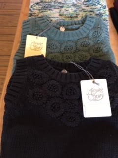 Black textured knit top with a Crazy Fox price tag